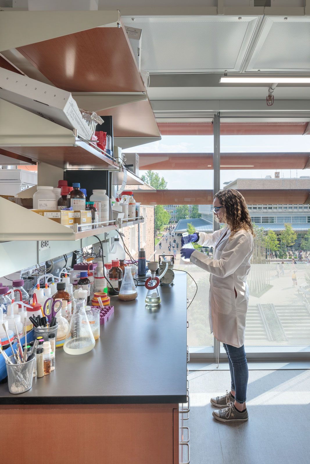 A student works at a lab counter in Washington University's Bryan Hall.