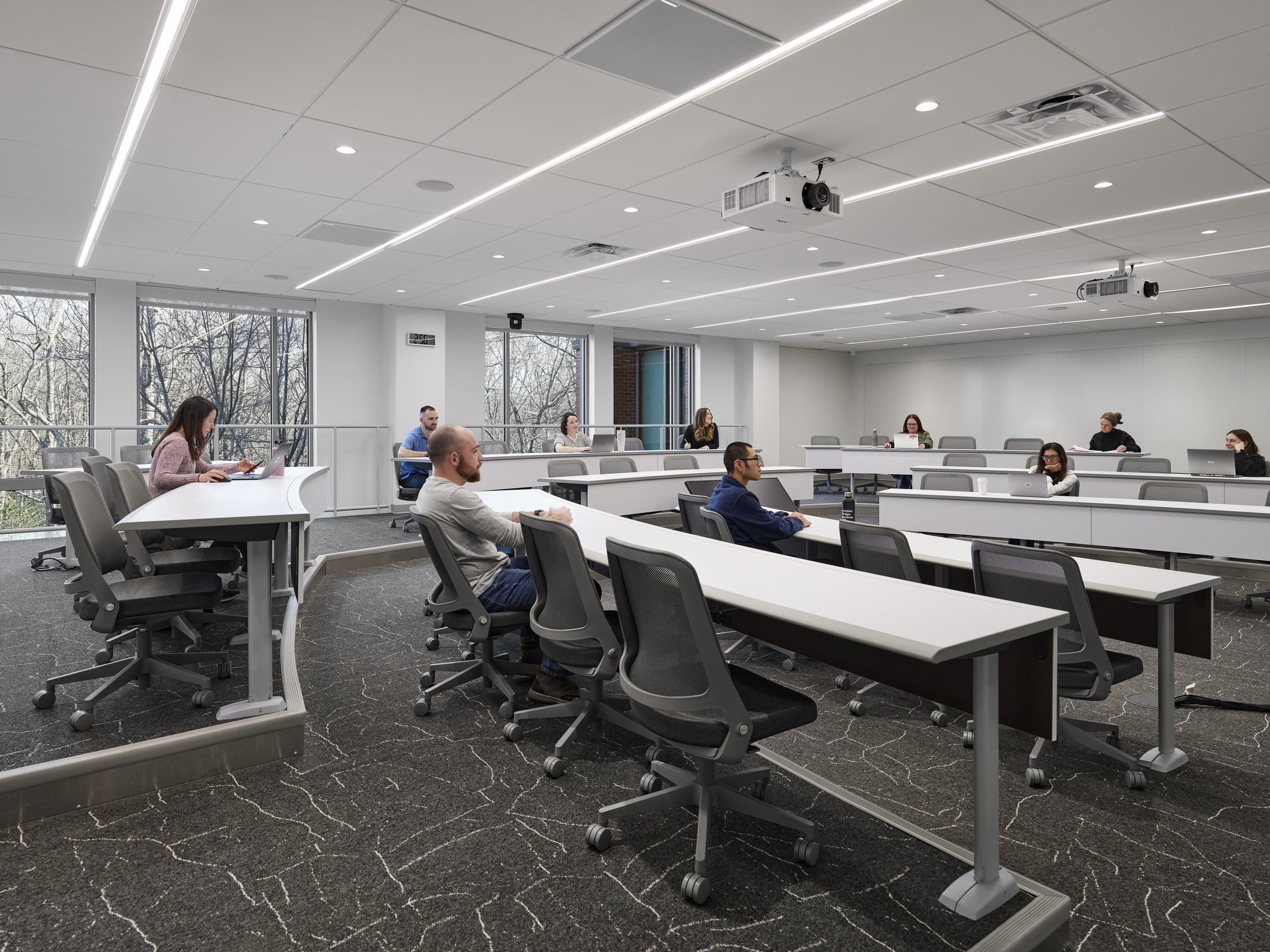 A large classroom within Bryant University's BELC shows lots of natural light