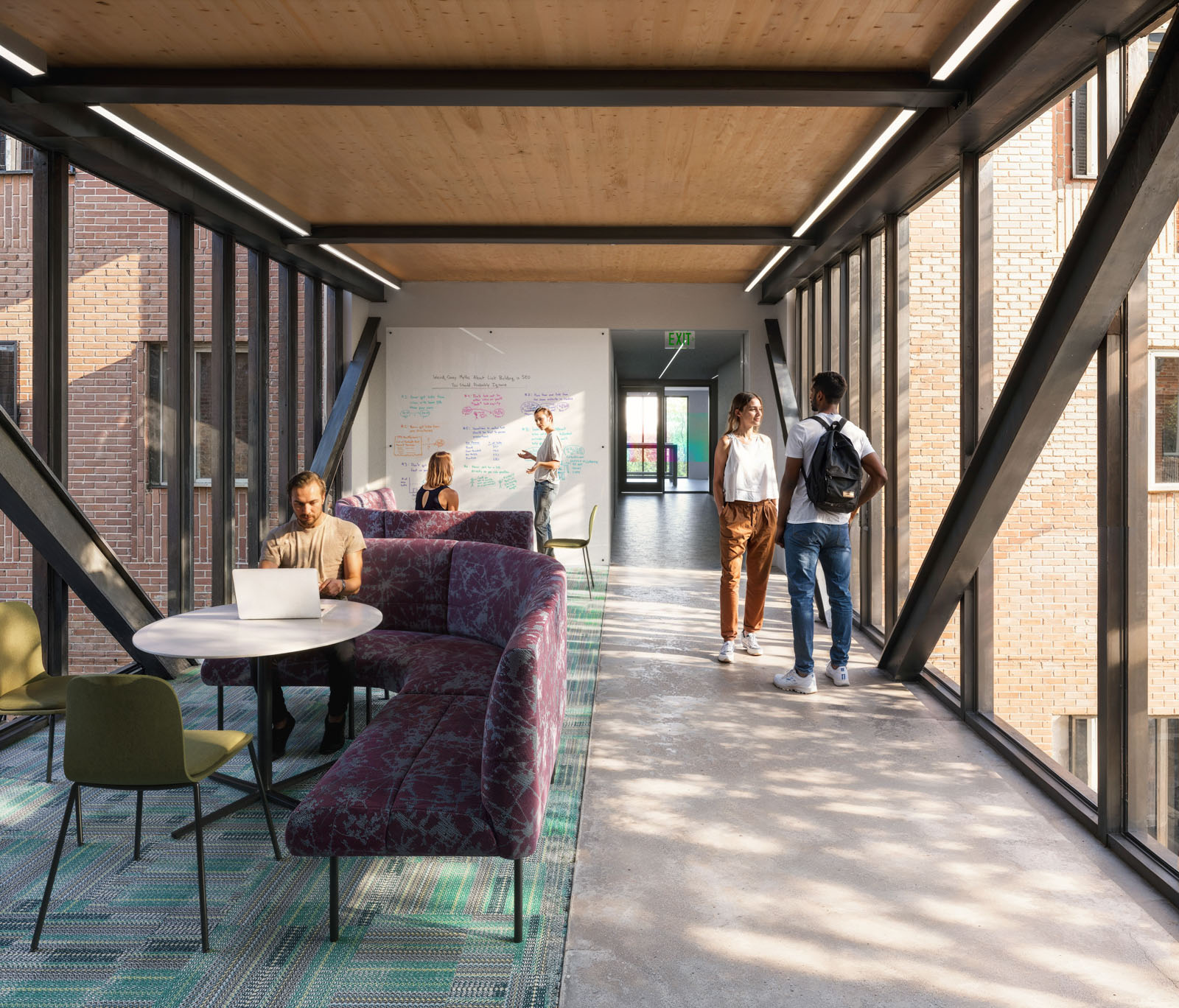 A rendering shows how mass timber is used in the ceilings and floors of a two-story glass bridge...