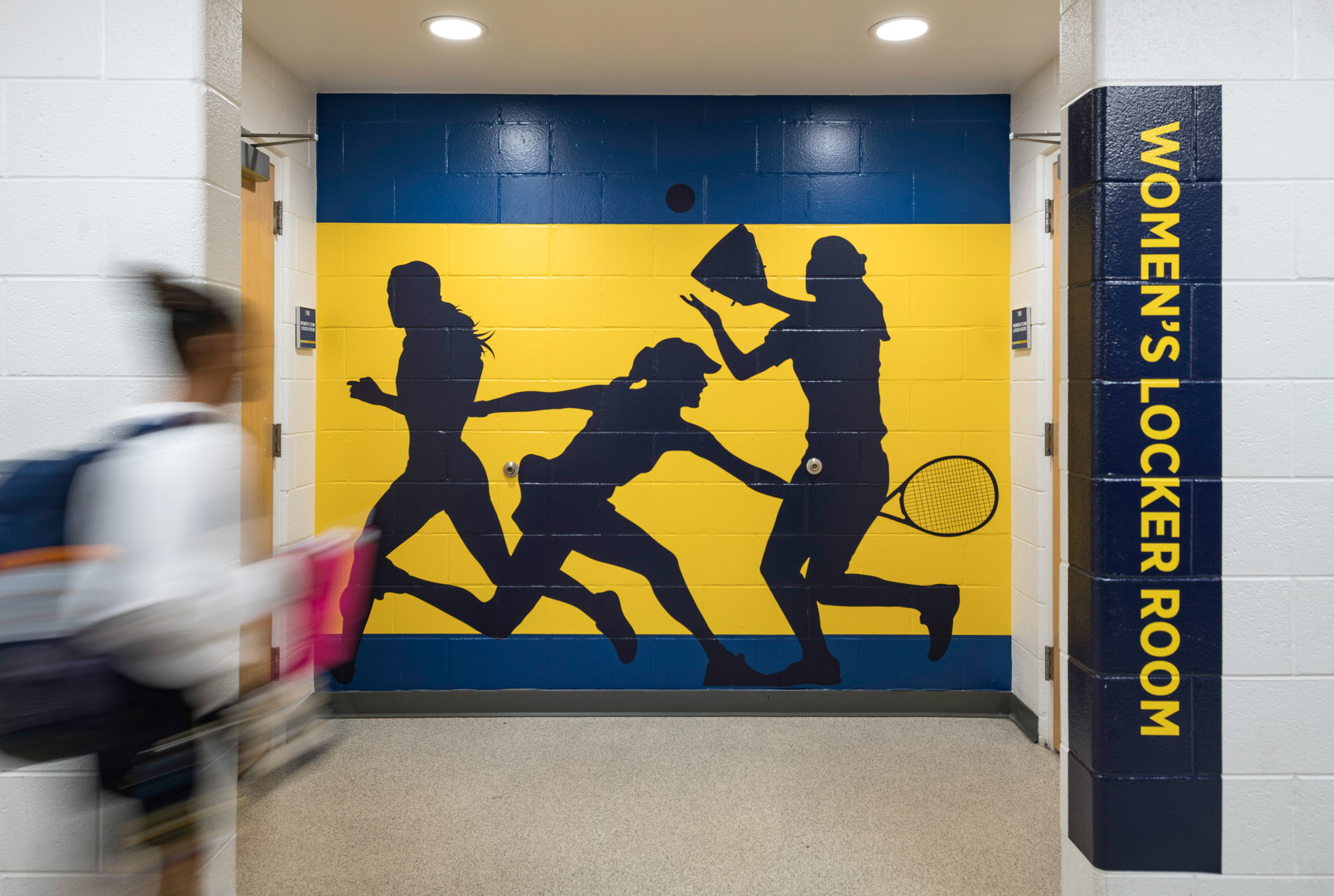 Environmental signage outside a women's locker room at Coppin State University