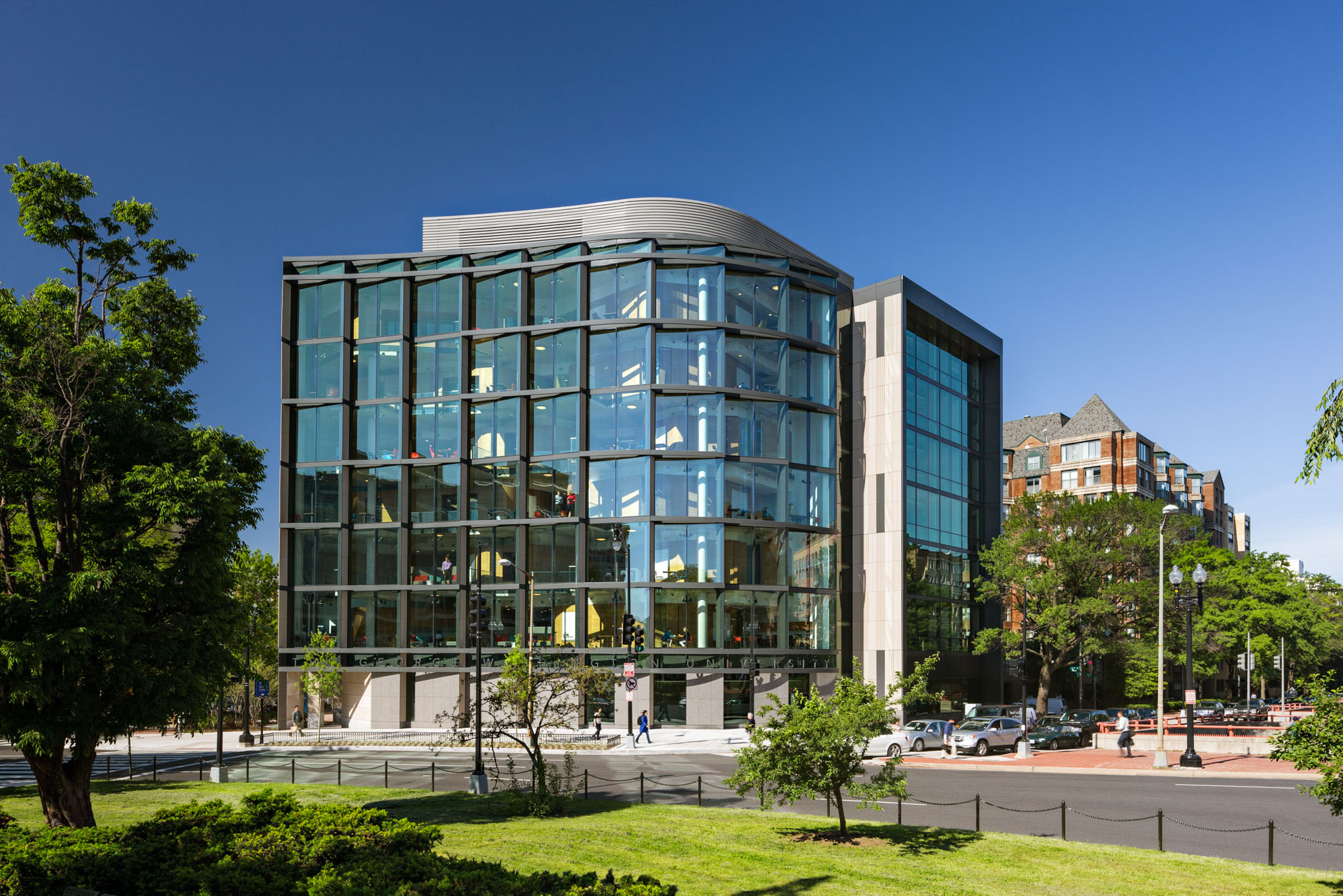 A curved glass academic building at The George Washington University