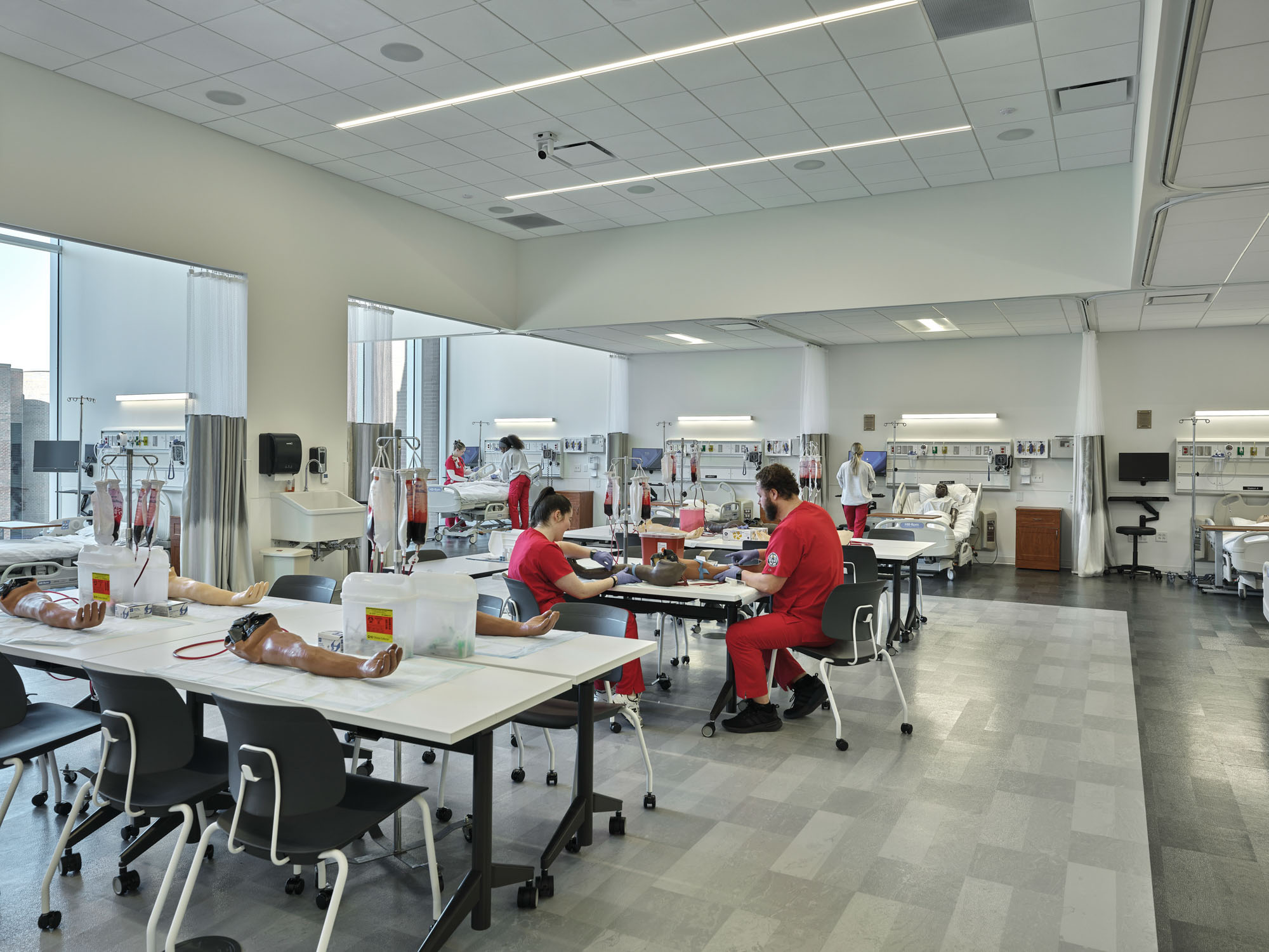Health professions students train in a simulated hospital suite with multiple patient bays and...