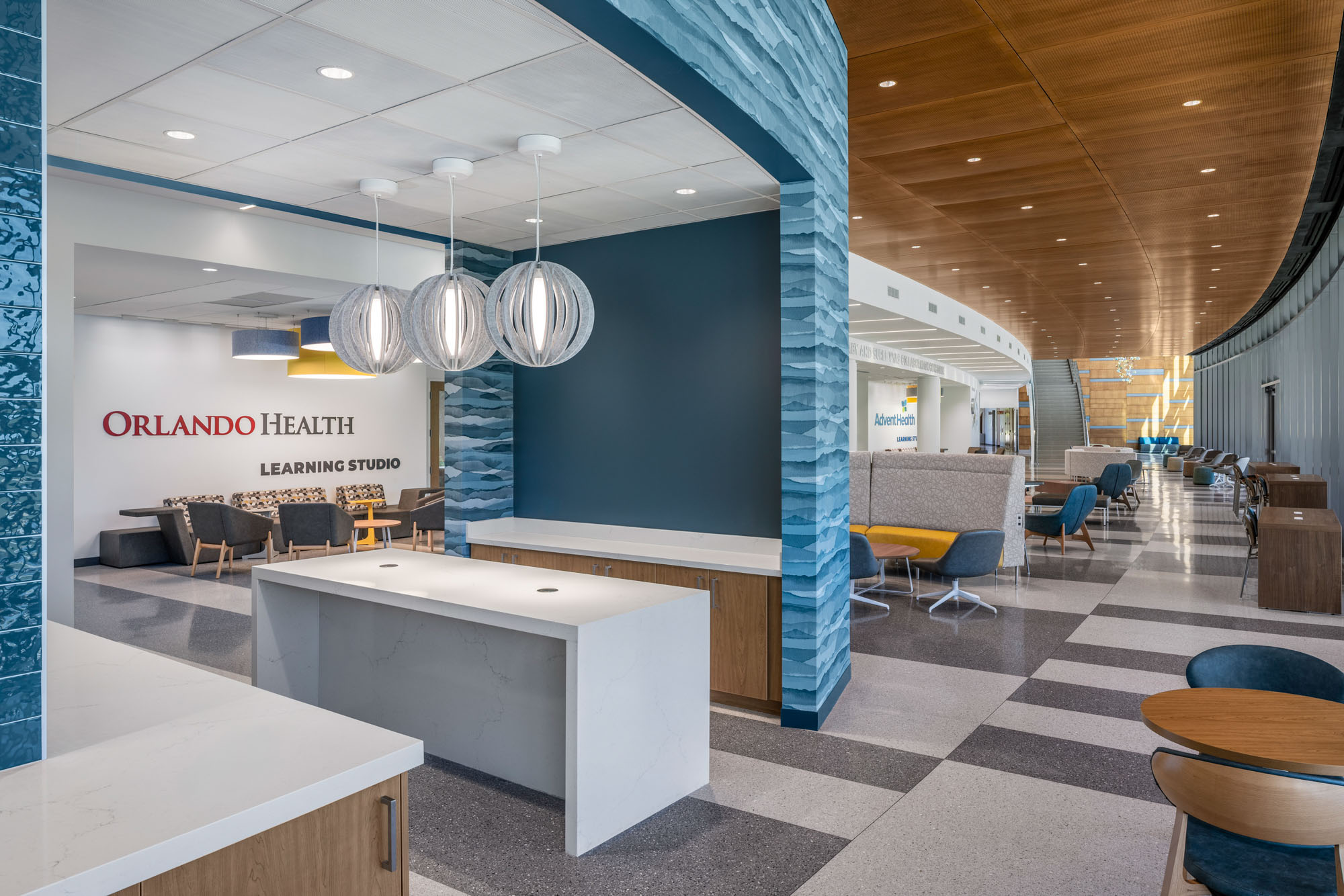 Collaborative learning lounge at the UCF Dr. Phillips Nursing Pavilion featuring flexible seating,...