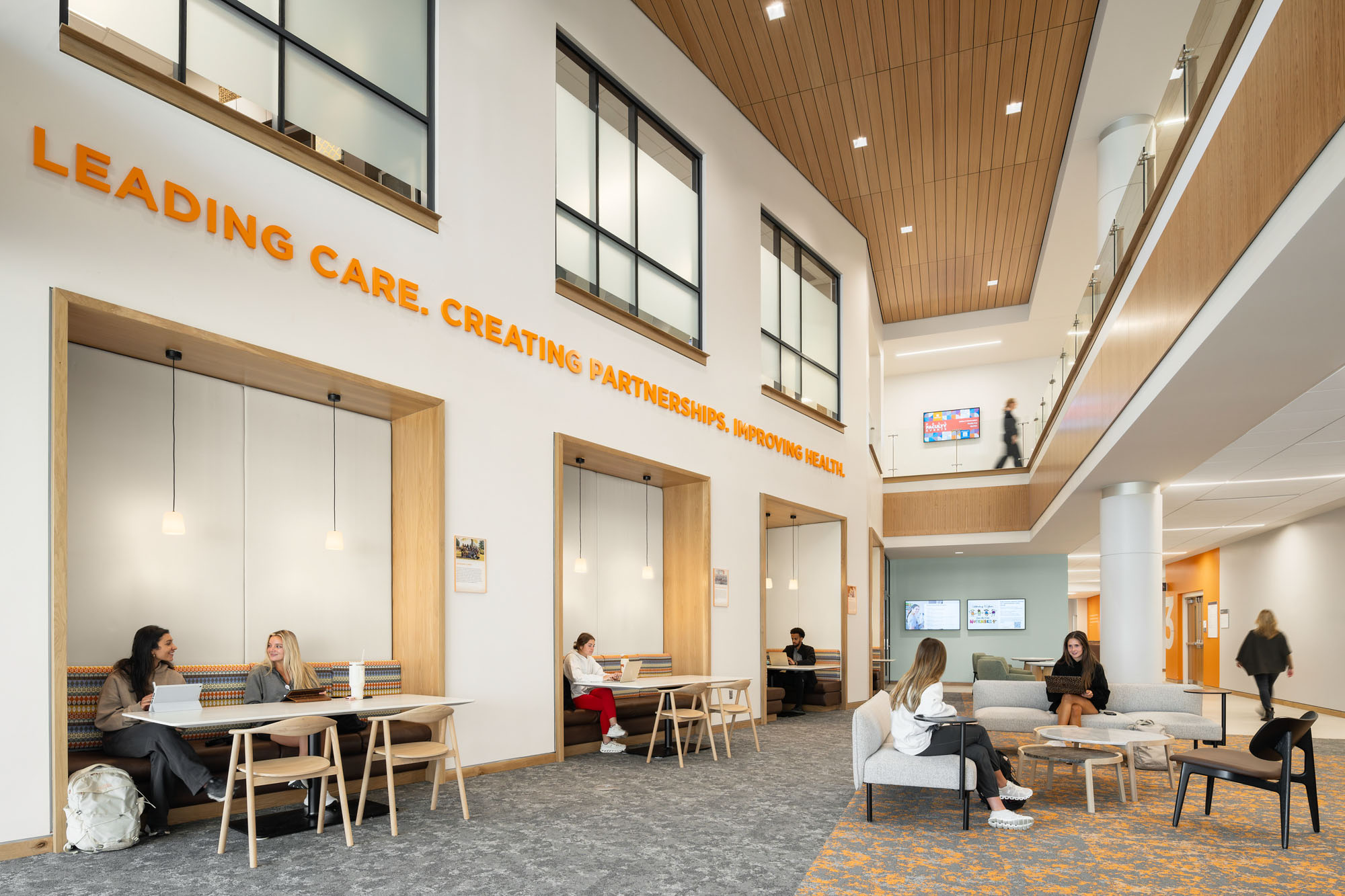 An open student space featuring booths and comfortable seating